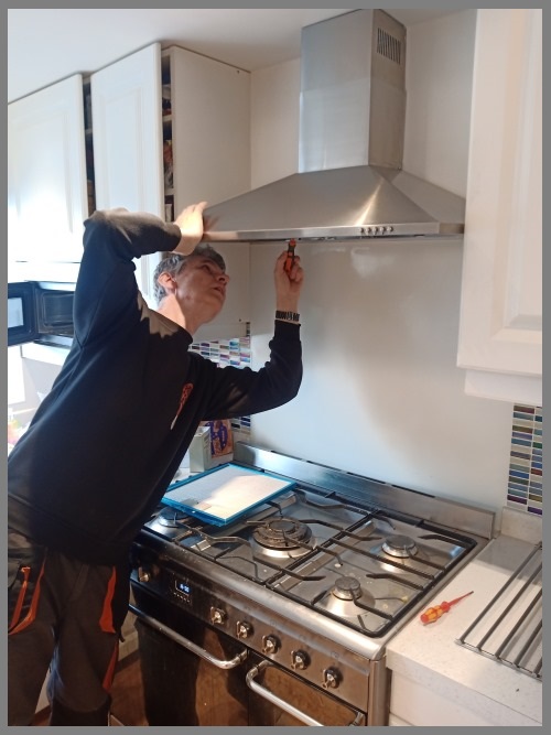 Kitchen hood installer in Amersham working safely on commercial ventilation